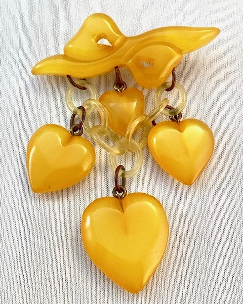 BP154 pearlized goldenrod bakelite heart bow & hearts  charm pin